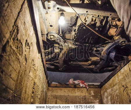 View Of The Car From Below. Autoservice Center. Car Maintenance.