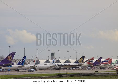 BANGKOK THAILAND - august 25 : large number of commercial cargo airline loading cargo belonging at suvarnabhumi airpot on august 252013 in bangkok thailand