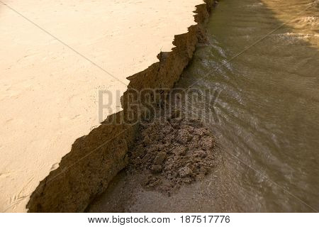Close up Sandbank was eroded with water.