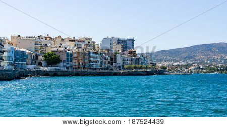 CRETE GREECE - JULY 11 2016: The embankment of a small elite tourist town - Elounda municipality of Agios Nikolaos.