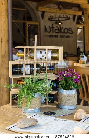 CRETE GREECE - JULY 11 2016: One of the outdoor restaurants of a coastal elite tourist town Agios Nikolaos on the Greek island of Crete.