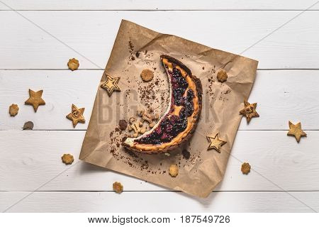 Top View Of Cheesecake With Cookies In The Form Of Stars On White Boards