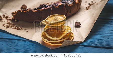 Dry Lemon And A Piece Of Pie On Blue Boards