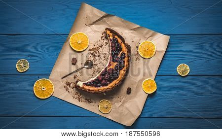 Top View Of Cheesecake In The Visible Moon Lemons On Blue Boards