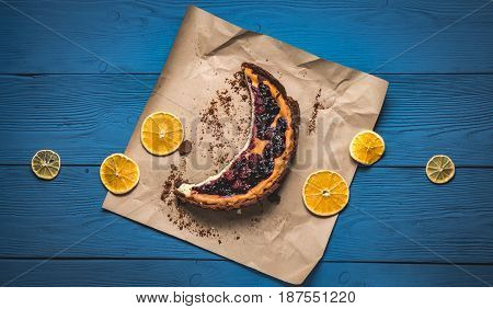 Top View Of Cheesecake In The Visible Moon Lemons On Blue Boards