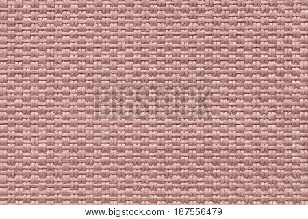 Dark pink woolen background of dense woven bagging fabric closeup. Structure of the rose cloth with natural texture. Cloth backdrop.