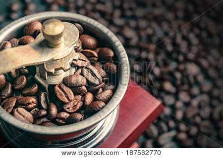 close up coffee bean in old grinder
