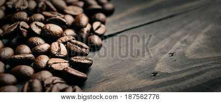 close up coffee bean on black wood