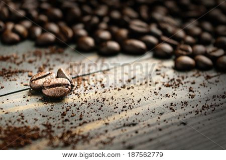 close up coffee bean on black wood