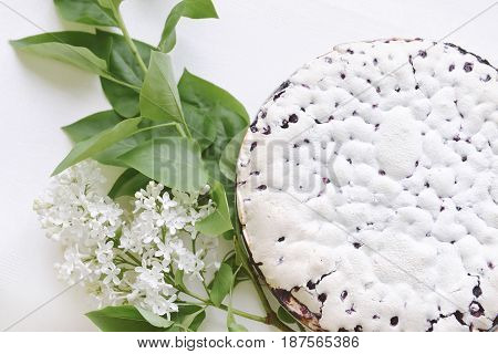 Tender homemade baking blueberry pie with lilac and tea