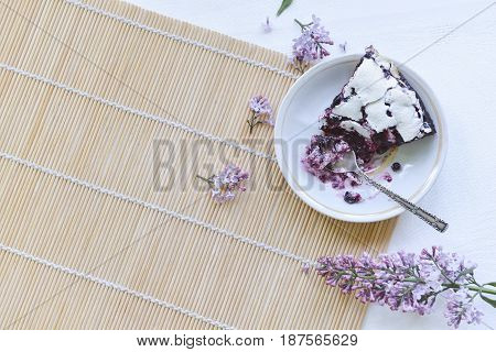 Tender homemade baking blueberry pie with lilac and tea