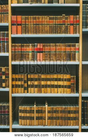Aged Ancient Antique Old Vintage Books On A Shelfs In Library.