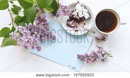 Tender homemade baking blueberry pie with lilac and tea