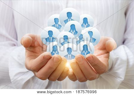 Customers Or Employees In The Hands Of A Businesswoman.