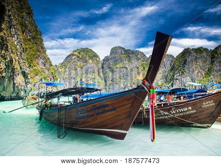 KO PHI PHI LEH, THAILAND, February 1, 2014: Traditional long tail boats on the beach of Maya Bay, Andaman Sea, famous tourist destination in the Ko Phi Phi achipelago