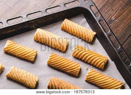 Homemade sweet cookies on a baking sheet. Baking in oven.