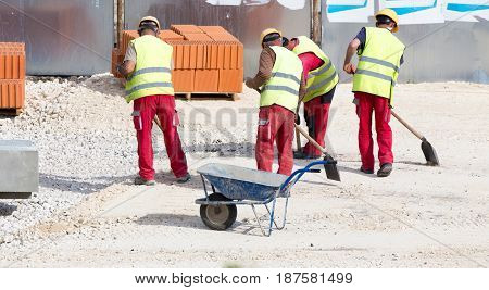 Construction Workers At Building Site