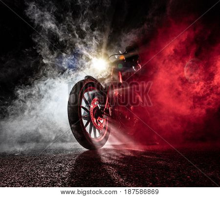 High power motorcycle chopper at night. Smoke on background.