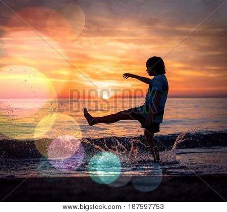 Happy boy enjoying the beach