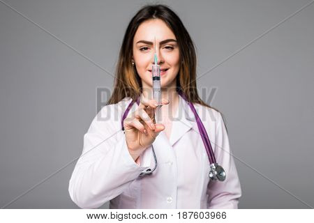 Woman Young Doctor With Syringe On Grey Background