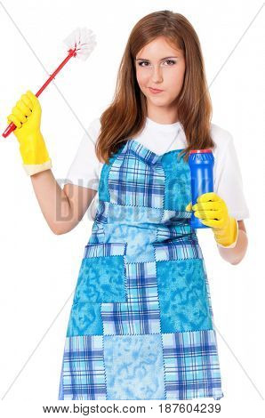 Tired young woman holding bottle of chemistry for cleaning house. Cleaning concept. Beautiful girl with cleaning tools and products on white background. Housekeeper isolated portrait.