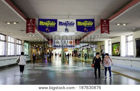 People Walking At The Railway Station
