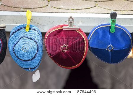 Colorful handmade Jewish caps with Star of David Kippah sold in the street shop before entering the Klausen Synagogue Prague Czech Republic
