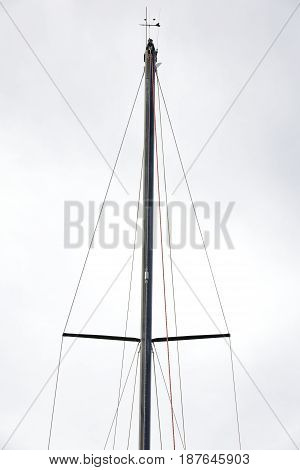 Mainmast Of A Sailboat Moored In Sea Port