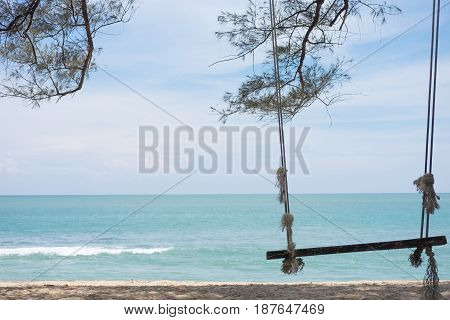 Wooden Ferris Wheel. Bind On Pine Branches And Have Beach,sea, Blue Sky Are Background. This Image F