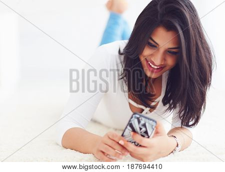 Beautiful, Indian Girl Surfing The Web Through The Mobile Device