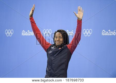 Rio de Janeiro Brazil - august 13 2016: Simone Manuel (USA) gold metal during medal ceremony after Women's 50 metre freestyle of the Rio 2016 Olympics