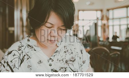 Asian Women Look Menu In Coffee Shop Vintage Style