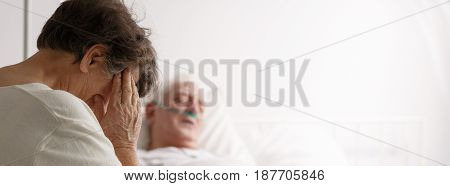 Senior Woman Visiting Her Sick Husband