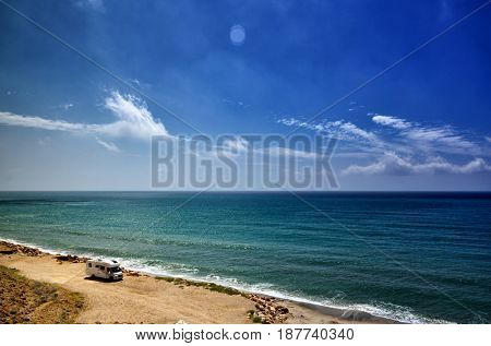 Holiday at the sea in a caravan, free camping on the beach with a motorhome