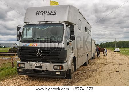 Tyumen, Russia - June 25, 2016: The 5th open championship of Russia on a plowed land. Horse van for animal transportation at hippodrome