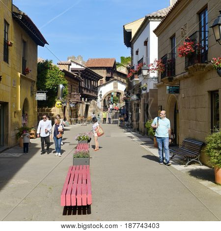 BARCELONA, SPAIN - MAY 20, 2017: People visiting the Poble Espanyol in Barcelona, Spain. This open-air museum recreates different Spanish buildings and was built for the 1929 International Exposition