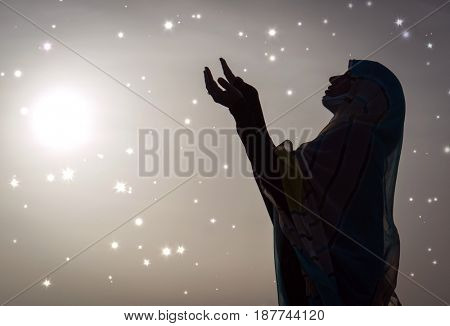  Copy space of silhouette woman rising hands on sunset sky double exposure colorful bokeh and bird fly background. Vintage tone filter effect color style.