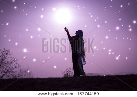  Copy space of silhouette woman rising hands on sunset sky double exposure colorful bokeh and bird fly background. Vintage tone filter effect color style.