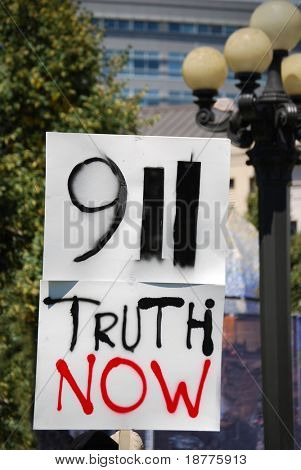 DENVER â AUGUST 26: A conspiracy theory supporter (not shown) from â9-11 Truth Nowâ holds a sign at a demonstration during the Democratic Convention on August 26, 2008 in Denver, Colorado.