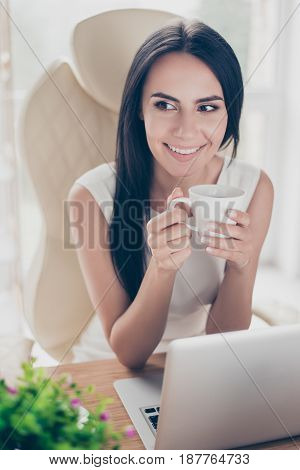 Close Up Portrait Of Young Cheerful Worker Dreaming About Vacation While Having A Hot Drink In The O