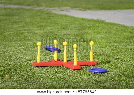 Ring Throw Summer Game On A Green Lawn