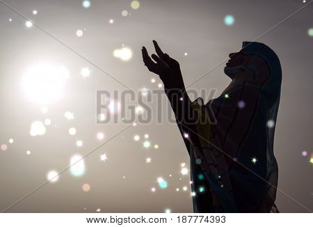 Muslim woman hands up for prying,  colorful  and  vintage tone filter effect color style.