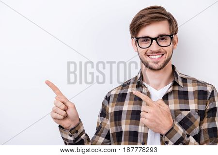 Successful Student In A Brown Checkered Shirt And Glasses With Bristle Is Showing The Copy Space On