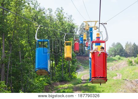 young loving happy couple in cable car ropeway.