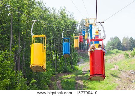 young loving happy couple in cable car ropeway.