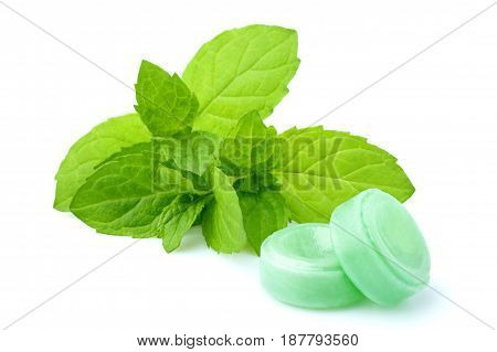 Candies for the throat with sprig of mint isolated on a white background.