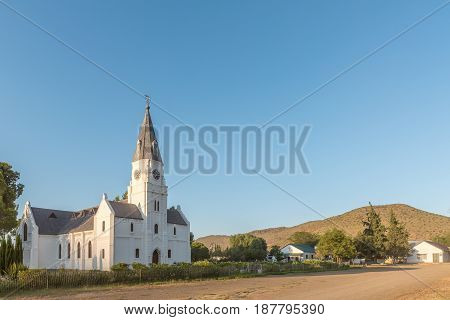 NIEU BETHESDA SOUTH AFRICA - MARCH 22 2017: Early morning street scene at the Dutch Reformed Church in Nieu-Bethesda an historic village in the Eastern Cape Province. The church was built in 1905