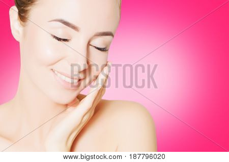 portrait of beautiful smiling woman with perfect skin