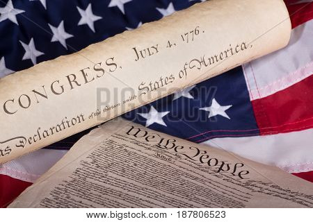 Declaration of independence and constitution on an american flag
