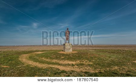 The road around the monument in the Kalmyk spring steppe. Russia